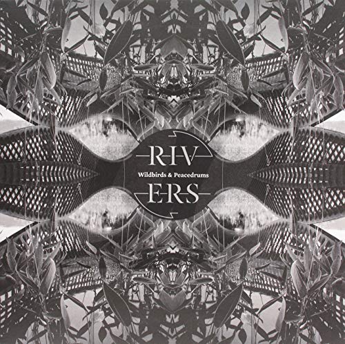 Black and white album cover with symmetrical, abstract plant and architectural imagery.