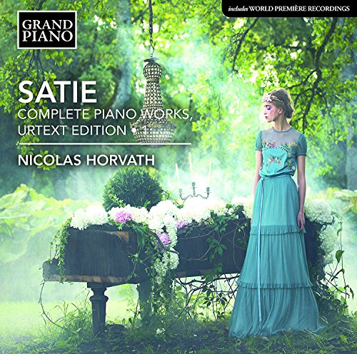 CD cover: woman in teal dress amidst lush green foliage.