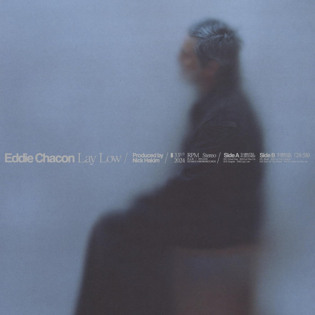 Vinyl record cover for Eddie Chacon’s “Lay Low” with a blurred portrait.