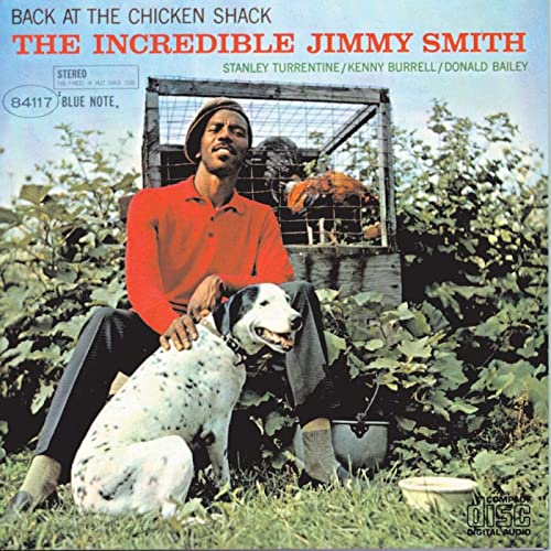 Album cover: Jimmy Smith’s “Back At The Chicken Shack” with man, dog, and chickens.
