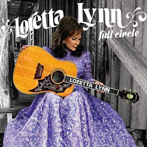 Loretta Lynn holds a guitar, wearing a lavender gown, album cover.