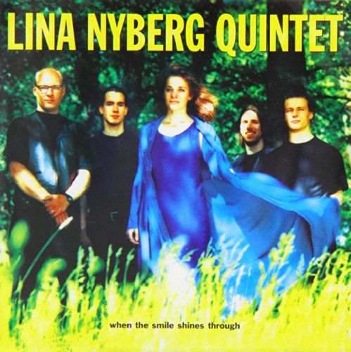 CD cover featuring five people in dark clothing amidst yellow grass.