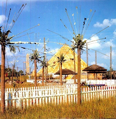 Album cover with a pyramid, strange trees, and a white picket fence.