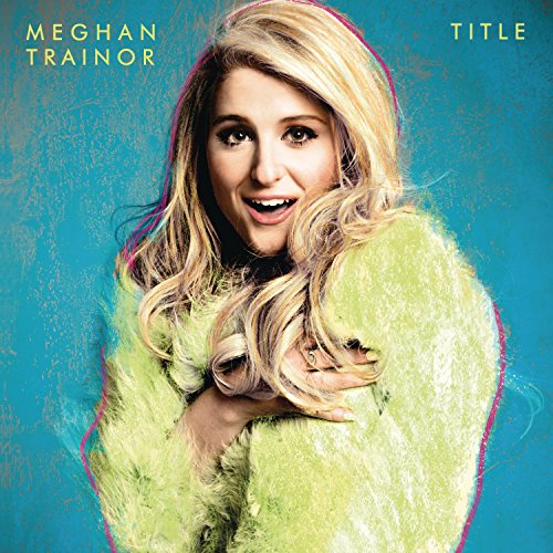 Meghan Trainor album cover featuring her in a yellow fuzzy coat.