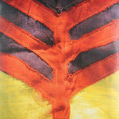 Close-up of textured, stitched red and dark fabric on yellow background.