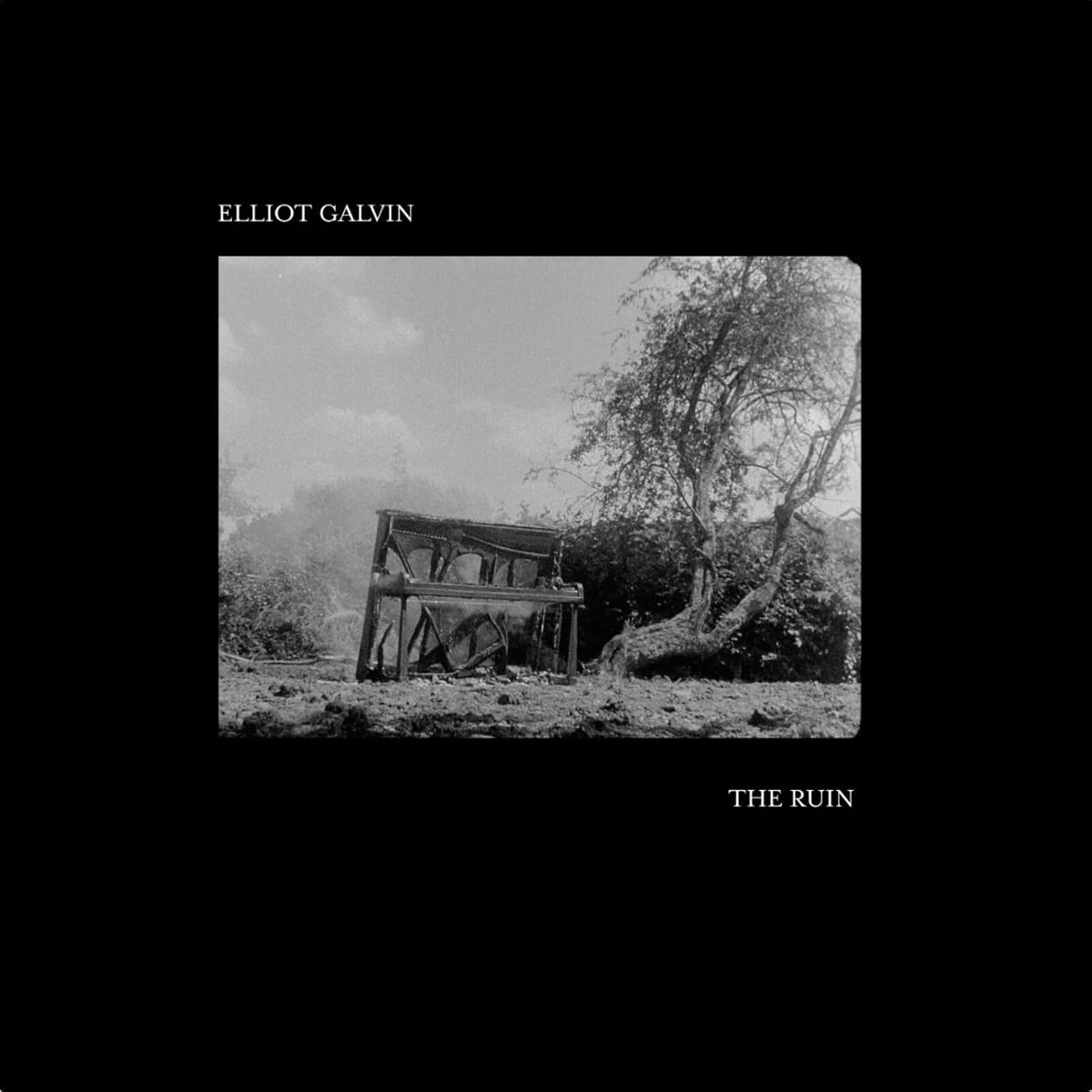 Black and white album cover featuring a ruined piano in a landscape.