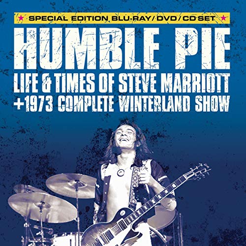 Steve Marriott of Humble Pie performing with a guitar on stage.