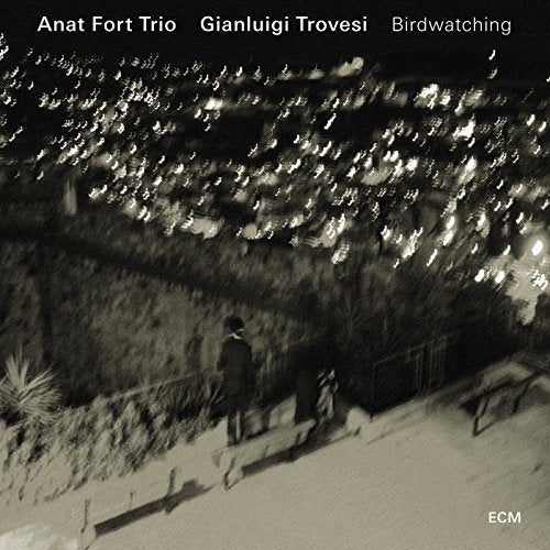 CD cover: blurred cityscape with a lone figure, nighttime scene.