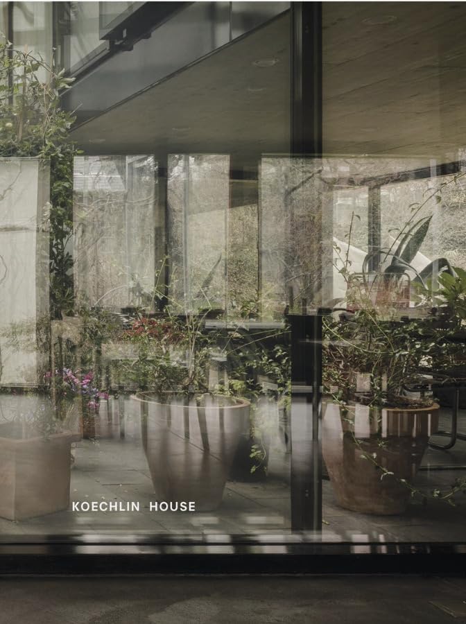Book cover featuring a modern house with large windows and plants.