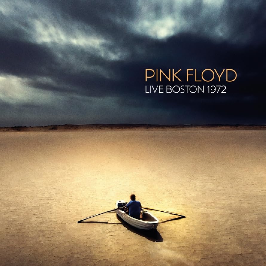Pink Floyd album cover: boat on a vast, cracked landscape under stormy skies.