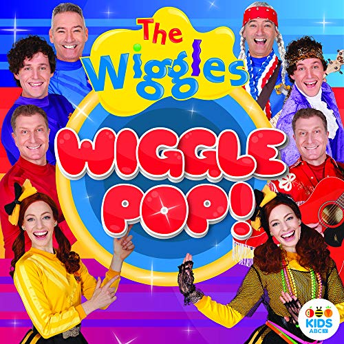 The Wiggles band members smiling on album cover for “Wiggle Pop!”.