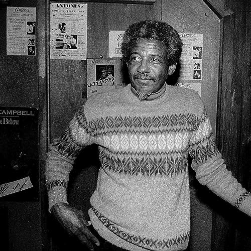 Black and white portrait of musician Lazy Lester wearing a patterned sweater.