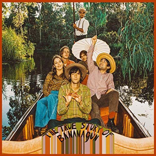Band in a boat with an umbrella, album cover art.