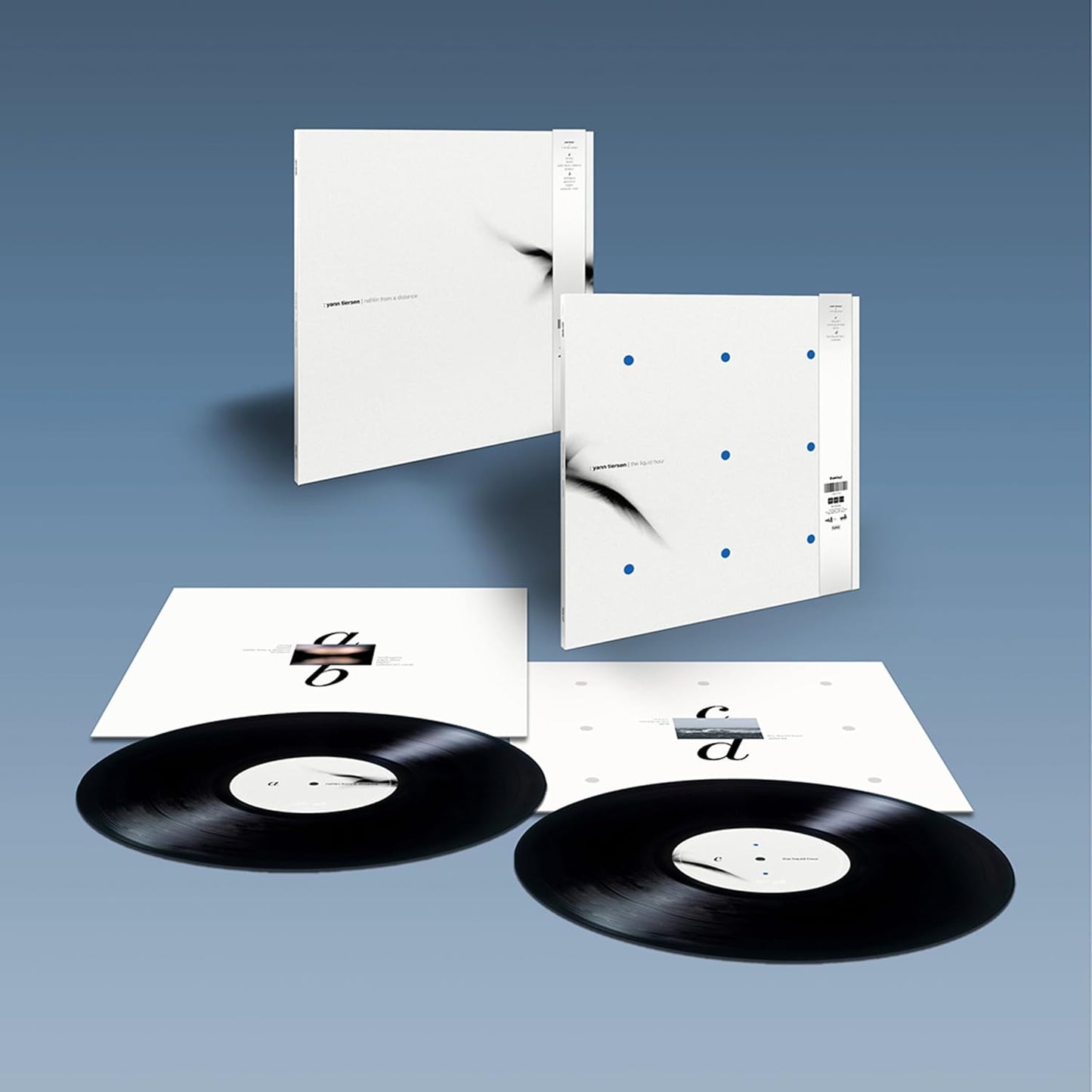 Yann Tiersen vinyl record with white cover and abstract blue dots.