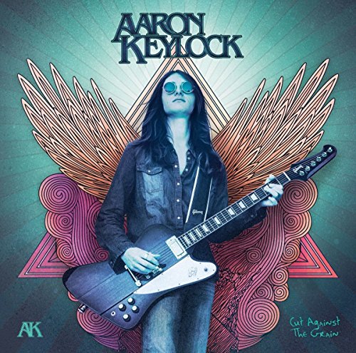 Aaron Keylock album cover featuring a guitarist with wing-like designs.