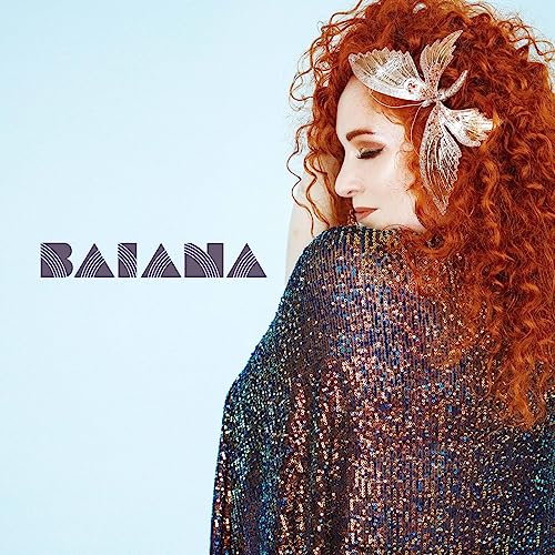 Album cover featuring a woman with red curly hair and a sparkly shawl.