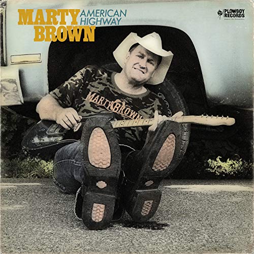 Marty Brown album cover: man with guitar leaning against a truck.