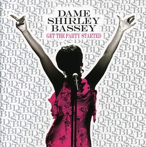 Dame Shirley Bassey album cover with singer raising arms and microphone.