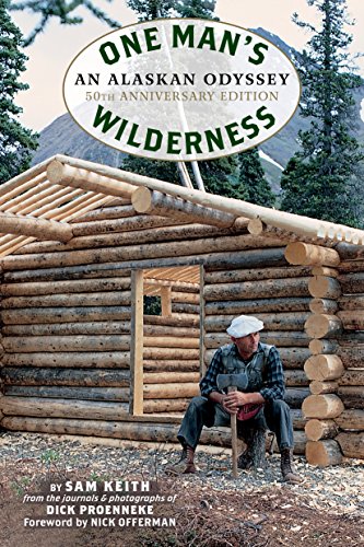 Book cover: man with axe sits before a log cabin in Alaska.