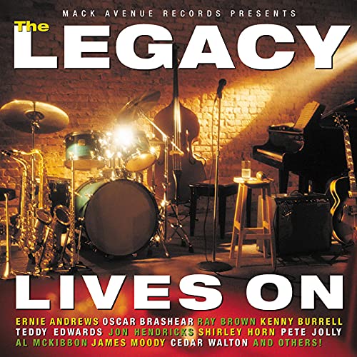 CD cover for “The Legacy Lives On” featuring jazz instruments onstage.
