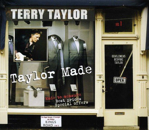 CD cover: storefront window displaying suits and a musician’s portrait.