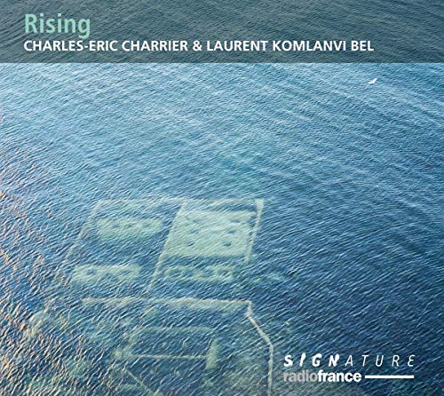 CD cover for "Rising" by Charrier & Komlanvi Bel, featuring ocean imagery.