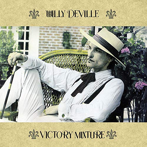 Willy DeVille album cover: man in a panama hat, seated outdoors.