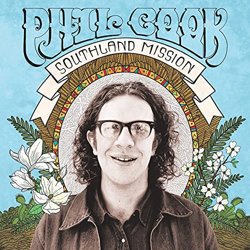 AlbumSHCHLSLHHLCLSLHSCLPCCLoud blue background album cover featuring a man with curly hair and glasses.