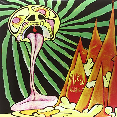 Psychedelic album cover with a yellow face, long tongue, and orange peaks.