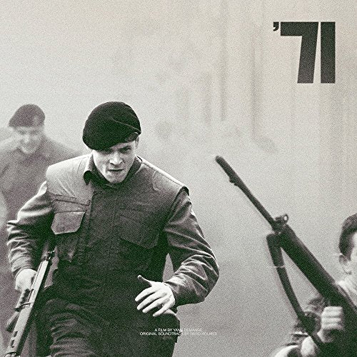 Black and white CD cover for “’71” soundtrack, man running with gun.