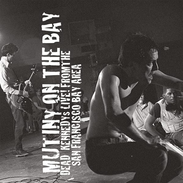 Black and white album cover featuring musicians performing on stage.