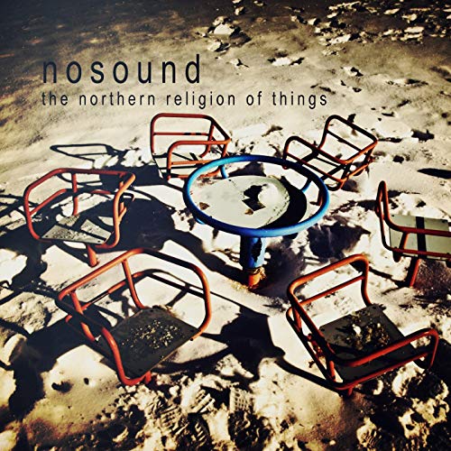 CD cover: red metal chairs and blue table in snow.