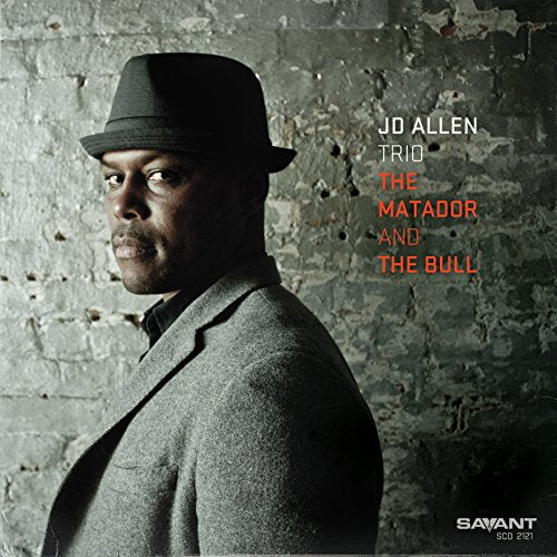 JD Allen album cover featuring a man in a hat against a brick wall.