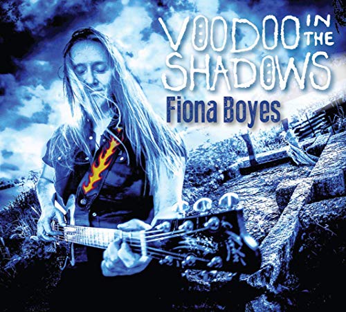 Fiona Boyes album cover: woman playing guitar, blue and grey tones.