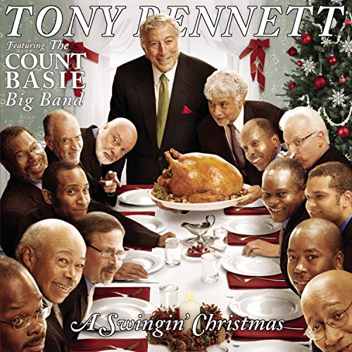 Tony Bennett and musicians around a Christmas dinner table.