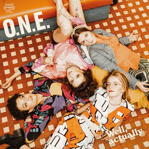 Four people lying on a tiled floor, wearing colorful patterned clothing.