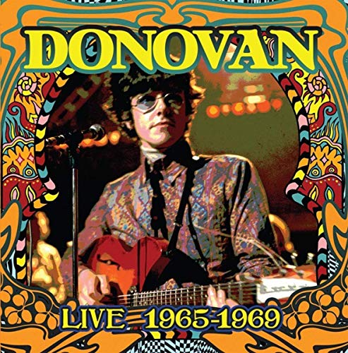 Donovan album cover, psychedelic art, musician playing guitar onstage.