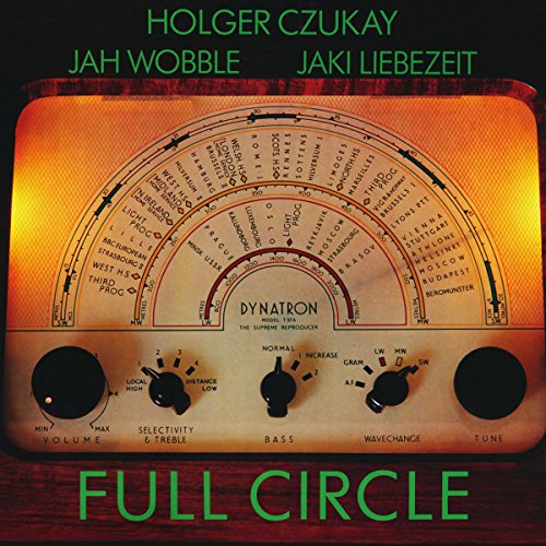 Orange vintage radio dial with text, album cover for Czukay & Jah Wobble.