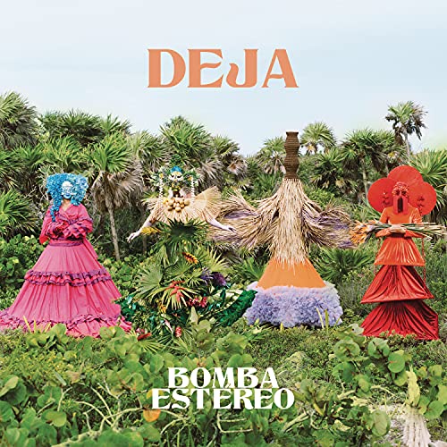 Album cover for Bomba Estereo’s “Deja” featuring figures in vibrant costumes.