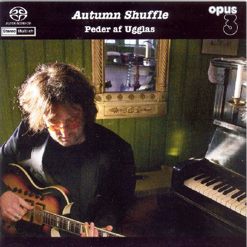 CD cover featuring a man with a guitar in a room with a piano.