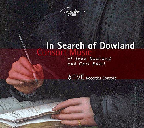 CD cover featuring a hand holding a quill over sheet music.