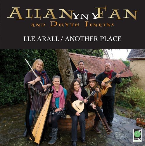 CD cover featuring a group of musicians with instruments outdoors.