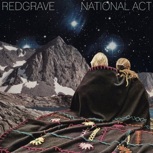 Vinyl album cover: two figures wrapped in a blanket before mountains.