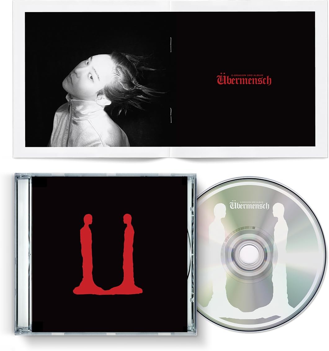 G-Dragon’s “UBERMENSCH” CD album with black cover and red imagery.