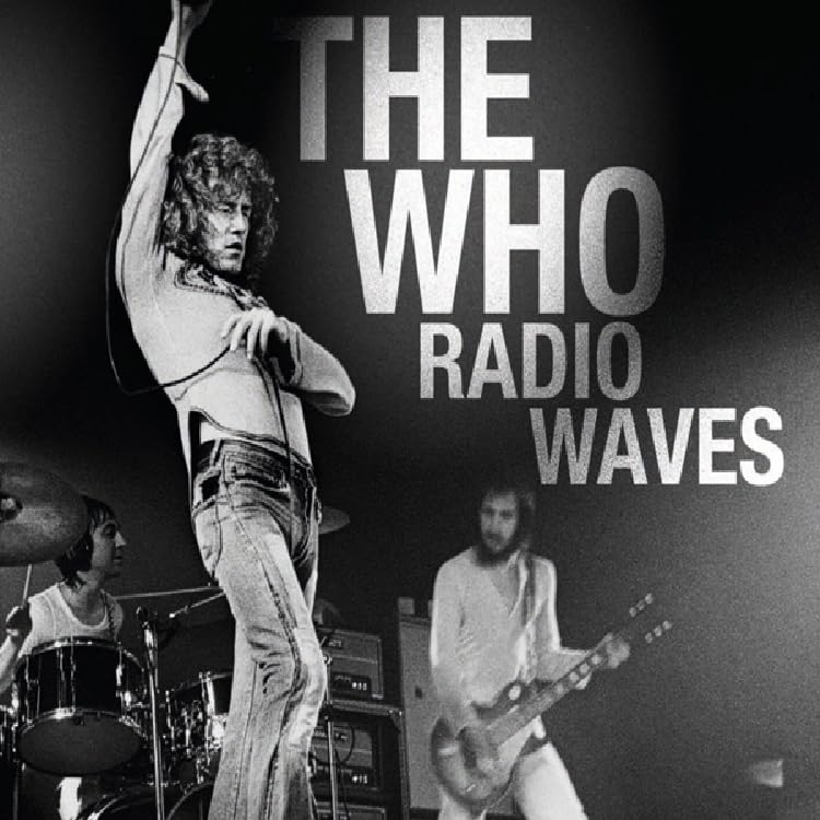 Black and white photo of The Who performing live on stage.
