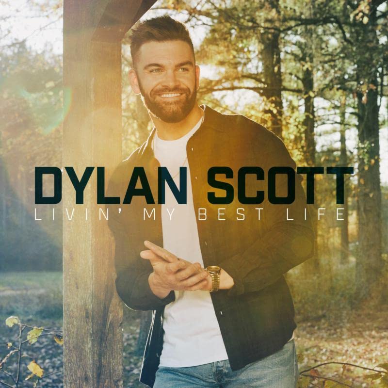 Dylan Scott album cover, portrait of a smiling man in a forest.