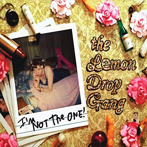 CD cover with a Polaroid photo of a woman and scattered flowers.