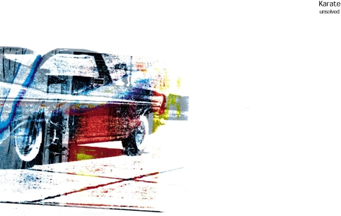 Abstract album cover for Karate’s “Unsolved” with blurred car imagery.