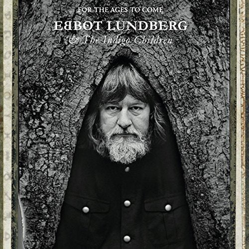 Black and white album cover featuring a bearded man in front of a tree.