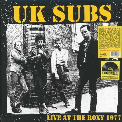 Vinyl record on yellow background, likely with band logo and live performance artwork.